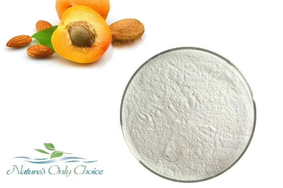 Apricot fruit and apricot kernel powder on white background.